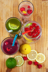 A serving platter with four drinks and smoothies lined up using food-grade, silicone straws that are reusable, and a plastic alternative to be sustainable