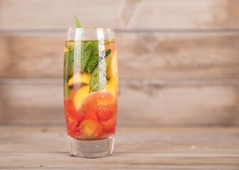 An appetizing cup of lemon mint strawberry tea to quench thirst in summer