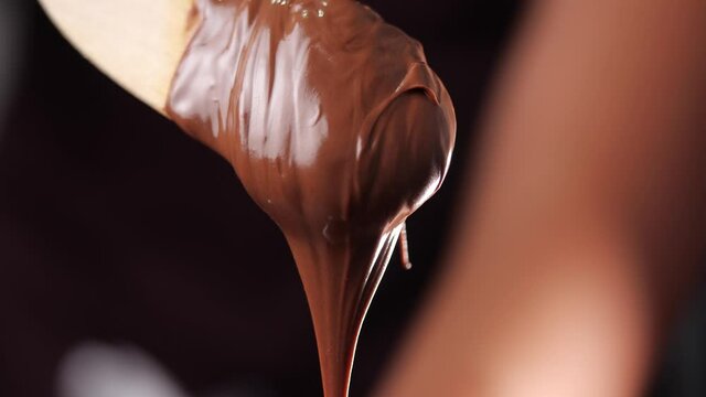 Close-up of hazelnut cream or chocolate on wooden spoon