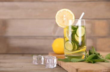 Cucumber lemon tea and fresh lemon fruit with ice cubes and mint leaves