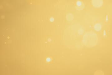 Dark Abstract Gold bokeh sparkle on black background