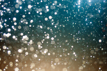 Abstract elegant glitter sparkle bokeh defocused on black background