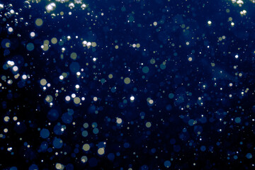 Abstract dark blue christmas glitter lights defocused bokeh