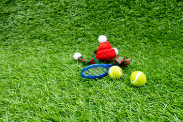 Tennis Christmas Holiday with Tennis ball and ornament on green grass