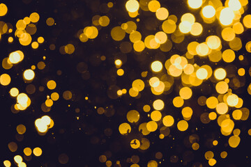 Fototapeta na wymiar Gold bokeh of lights on black background