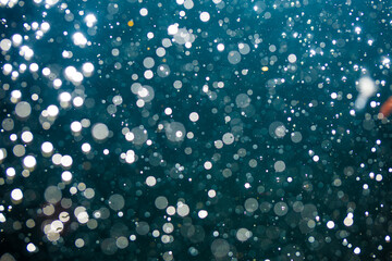 Abstract white bokeh with black background