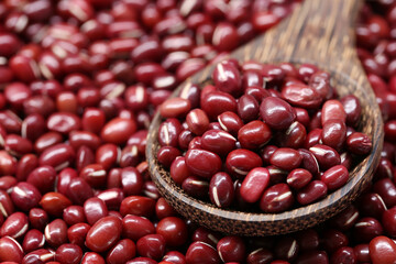 Fresh small seed of red beans in wooden spoon.