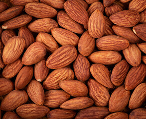 Background of raw peeled almonds.