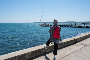 Woman looking at the Black Sea on the waterfront in the city of Kerch on the Crimean Peninsula