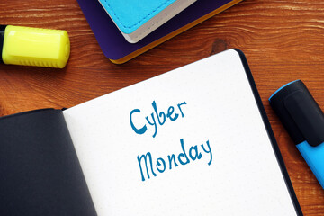 Financial concept meaning Cyber Monday with inscription on the sheet.