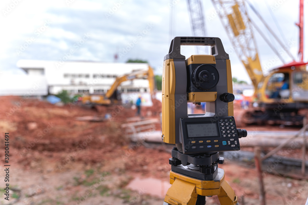 Wall mural theodolite equipment of surveyor builder engineer during surveying work in construction site