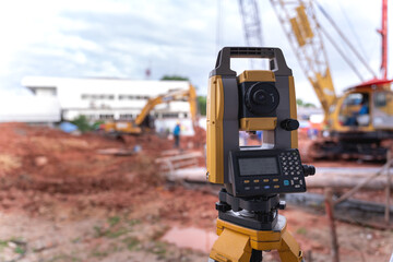 Theodolite equipment  of Surveyor builder engineer during surveying work in construction site