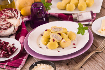 Potato gnocchi stuffed with radicchio and ricotta.