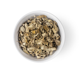 dry moringa leaves in white bowl on white background