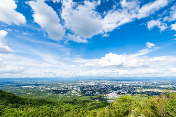 Fototapeta na wymiar view in the mountains with cityscape over the city airatmosphere bright blue sky background abstract clear texture with white clouds. of Chiang Mai,Thailand