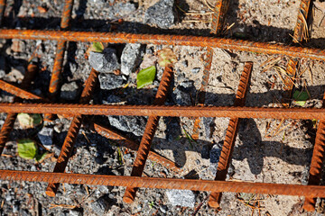 rusty rebar lying on the ground