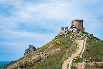 Fototapeta na wymiar Tower of ancient Genoese fortress Cembalo built around 1343 near the modern city of Balaklava on the Crimean Peninsula