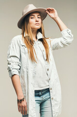 sexy blond woman in jeans and hat