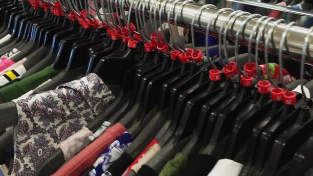 Slow Motion Through Racks of Different Clothing Closeup