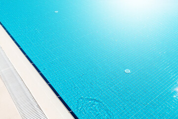 Sunny swimming pool in tropical resort