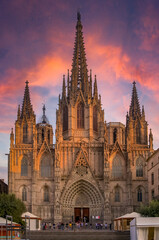 Fototapeta na wymiar Famous Gothic Cathedral of the Holy Cross and Saint Eulalia or Barcelona Cathedral, seat of the Archbishop of Barcelona, Spain with tourists at sunset