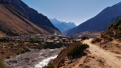 Beautiful view of small sherpa village Hilajung located in a valley near Thame, Khumbu Region, Sagarmatha National Park, Himalayas, Nepal on Three Passes Trek. Sunny day with no clouds.