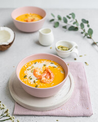 Pumpkin soup with shrimps and coconut milk