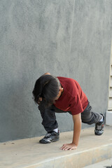 Young asian boy work out in outdoor. Active kids. Self care and health care concept.