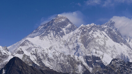Fototapeta na wymiar Panorama view of majestic Mount Everest (summit 8,848 m) with adjacent mountains Lhotse and Nuptse from Renjo La pass, Sagarmatha National Park, Nepal on sunny day with few clouds.
