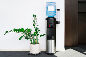 Large water dispenser in the office, with cold and hot taps.