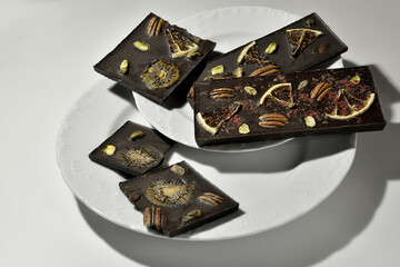 Chocolate with nuts and dried citrus fruits.