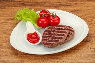 Grilled burger cutlet with sauce
