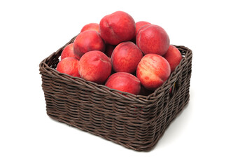 red peaches in basket.