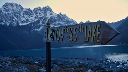 Signpost in Sherpa village Gokyo, Sagarmatha National Park, Nepal showing the direction to the...