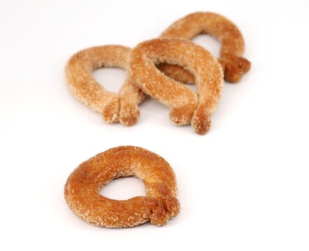 Torcetti , typical italian twisted cookies from Piedmont, on white background.