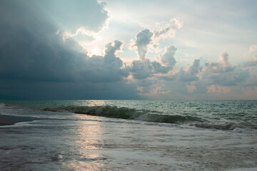 Beach at sunset in Sicily, Italy. Landscape with Mediterranean sea and dramatic clouds before a...