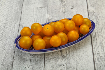 Fototapeta na wymiar Fresh yellow cherry tomato heap