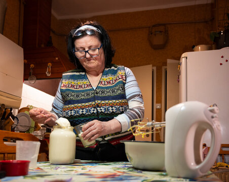 Senior Woman Baking Homemade Cake