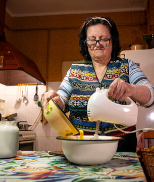 Senior Woman Baking Homemade  Cake