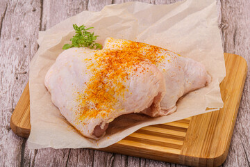 Raw chicken thigh with spices