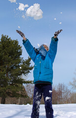 Young girl playing with snow