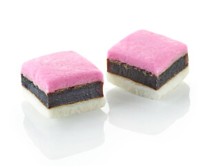 two pink candies with licorice