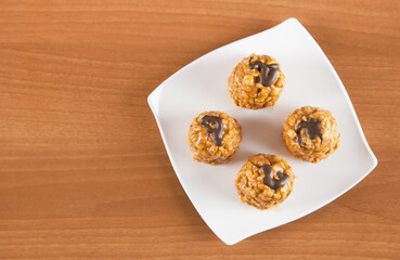 Delicious freshly baked anthill with plate on a wooden table.