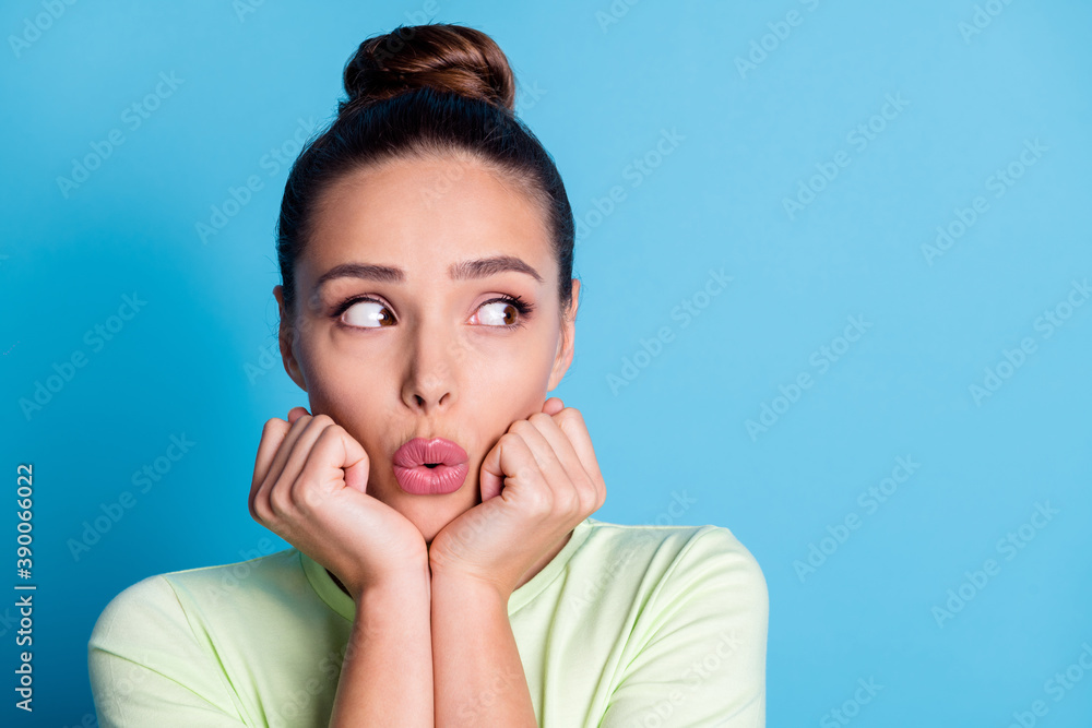 Canvas Prints Photo of astonished girl touch fist chin look empty space isolated over blue pastel color background