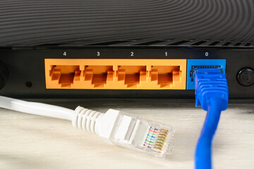 Home wi-fi router for internet connection with two patch cords with rj45. Concept home network,...
