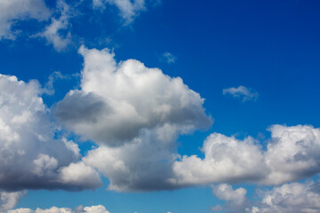 White clouds cumulus floating on blue sky for backgrounds concept