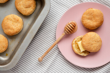 Homemade Flaky Buttermilk Biscuits on a pink plate, top view. Flat lay, overhead, from above.