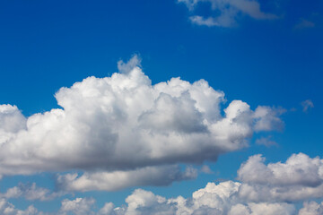 Naklejka na ściany i meble White clouds cumulus floating on blue sky for backgrounds concept