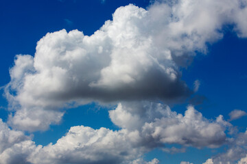 White clouds cumulus floating on blue sky for backgrounds concept