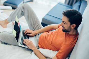 Colorful sticky notes on the laptop of smiling person